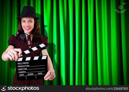 Woman gangster with movie clapper