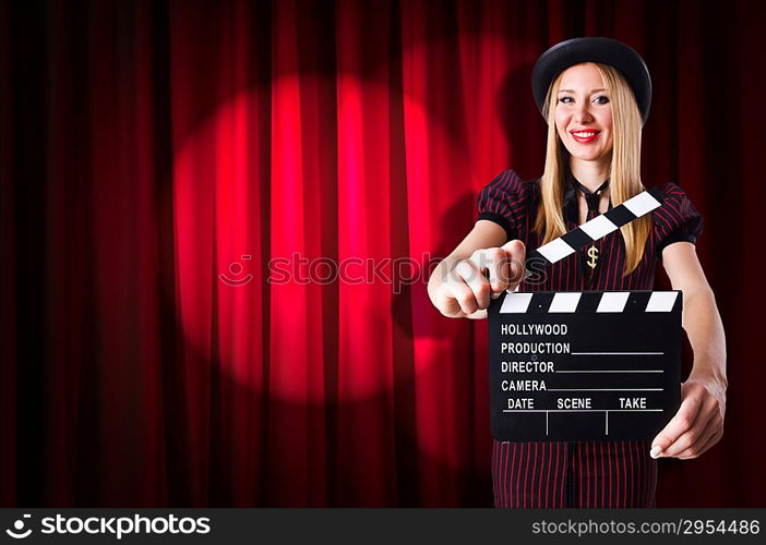 Woman gangster with movie clapper