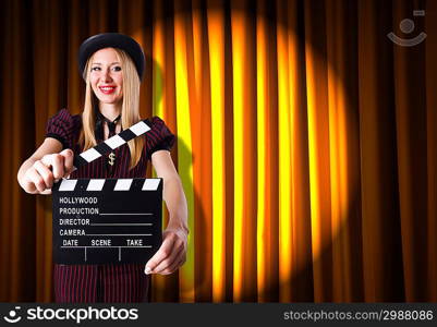 Woman gangster with movie clapper