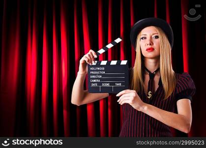 Woman gangster with movie clapper