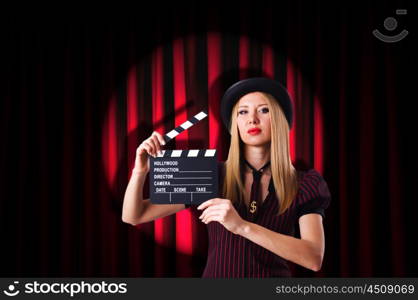 Woman gangster with movie clapper