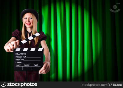 Woman gangster with movie clapper