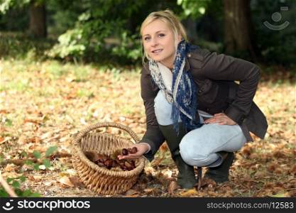 Woman gathering chestnuts