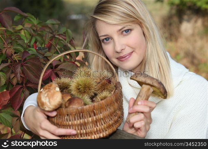 Woman gathering mushrooms and chestnuts