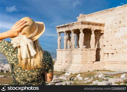 Woman Gazes at The Erechtheion or Temple of Athena Polias, Acropolis, Athens, Greece.