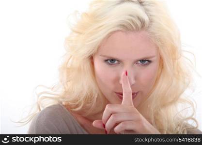 Woman gesturing for quiet