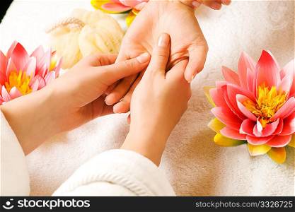Woman getting a hand massage (close up on hands)