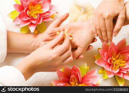 Woman getting a hand massage (close up on hands)