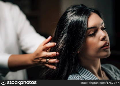 Woman getting a new hairstyle.. Hairstyling in Hair Salon
