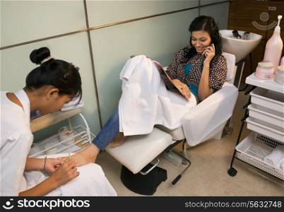 Woman getting a pedicure at a parlor