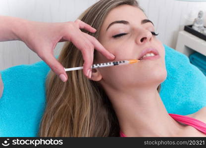 Woman getting anticellulite and anti fat therapy in beauty salon