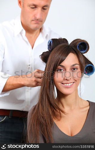 Woman getting hair-curlers