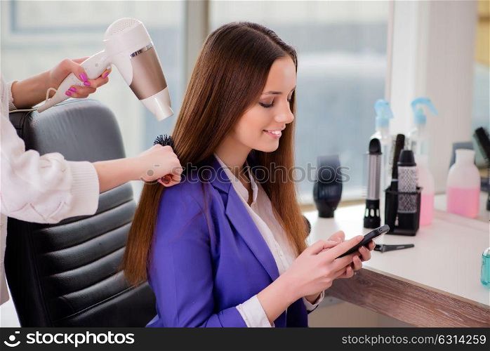 Woman getting her hair done in beauty shop