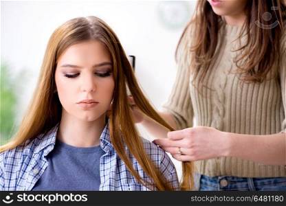 Woman getting her hair done in the beauty salon