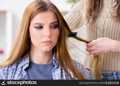 Woman getting her hair done in the beauty salon