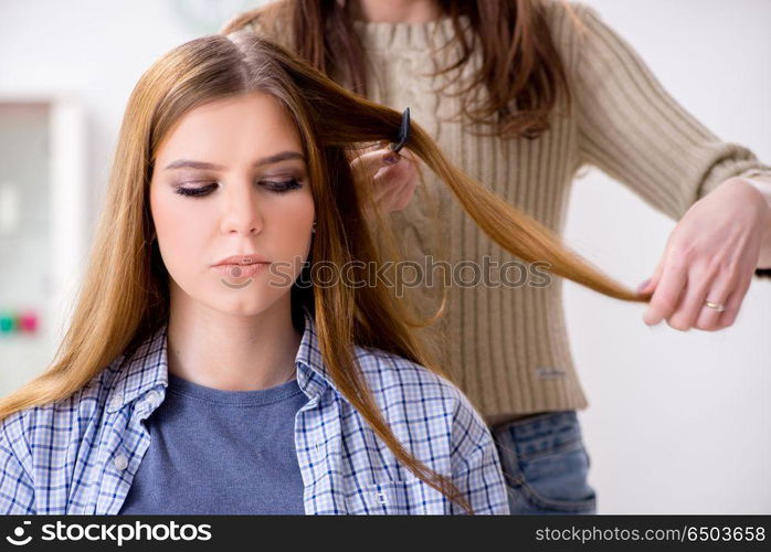 Woman getting her hair done in the beauty salon