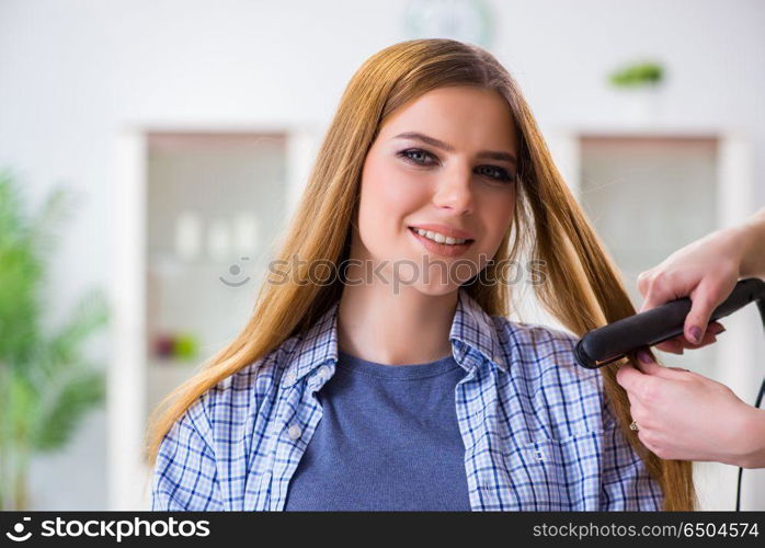 Woman getting her hair done in the beauty salon