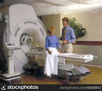 Woman Getting Instructions Before Her CAT Scan