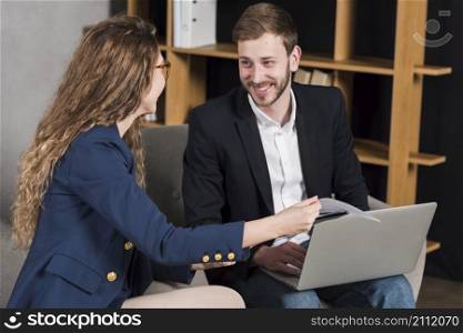 woman getting interviewed by man job position