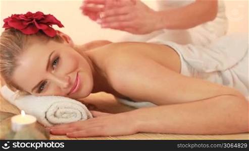 woman getting massage at spa