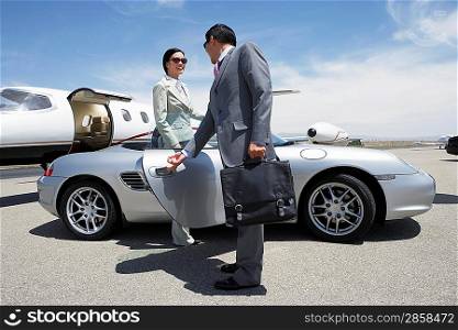 Woman Getting Out of a Convertible