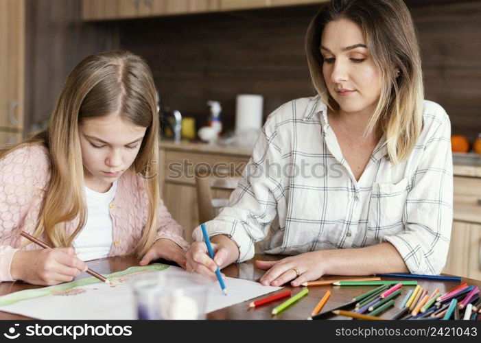 woman girl drawing together