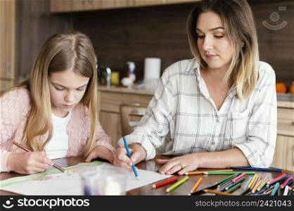 woman girl drawing together