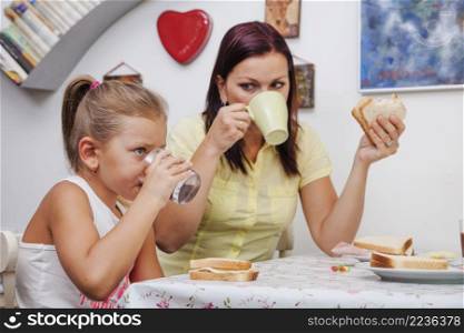 woman girl having breakfast