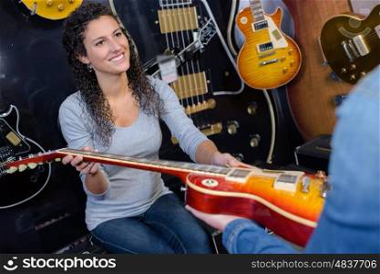 woman giving a guitar