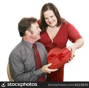Woman giving her husband valentine chocolate. Isolated on white.