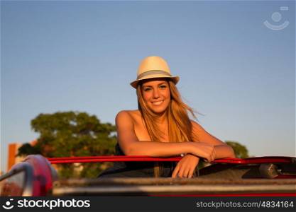 Woman going on a roadtrip in her convertible car