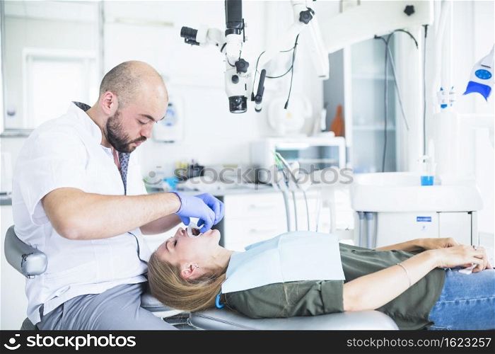 woman going through dental treatment with expander