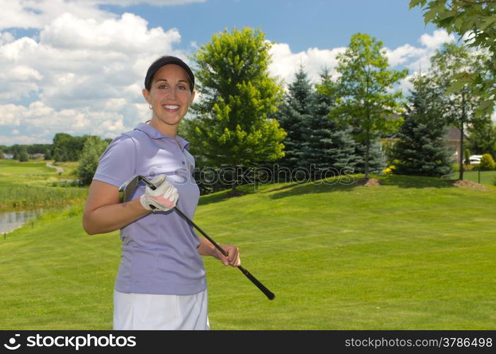 Woman golf player on the fairway