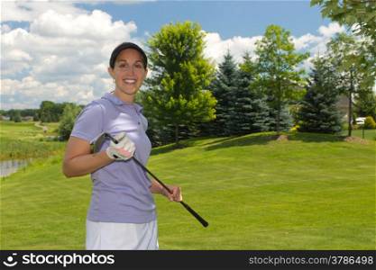Woman golf player on the fairway
