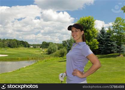 Woman golfer relaxing on the fairway
