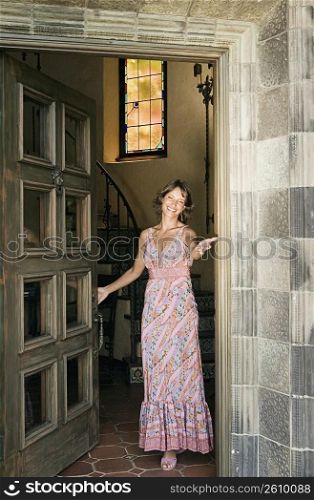 Woman greeting at door