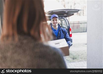 woman greeting deliveryman porch