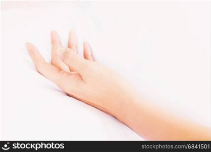 Woman hand after have sex on a bed in morning, Hand sign love and sex concept