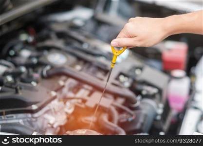 woman hand  check oil level in car engine. Self Maintenance, repair and problem concept