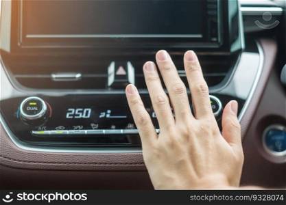 Woman hand checking the air flowing during driving car on the road, air conditioner cooling system inside the car. Adjust, temperature and transport concept