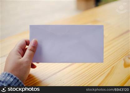 Woman hand hold the empty Envelope Letter Communication