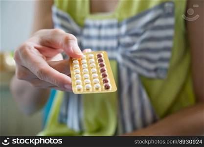 Woman hand holding a contraceptive panel prevent pregnancy