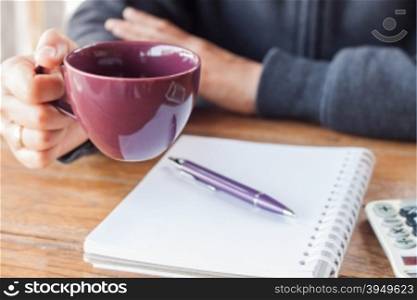 Woman hand holding a cup of coffee, stock photo