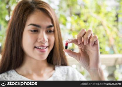 woman hand holding a pills take medicine according to the doctor’s order