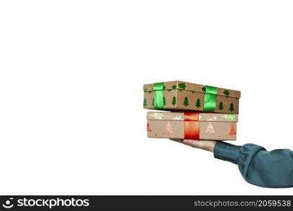 Woman hand holding a stack of Christmas gifts with red bow and isolated on white background With clipping path included. copy space Holiday concept space for text. Woman hand holding a stack of Christmas gifts with red bow and isolated on white background With clipping path included. copy space Holiday concept