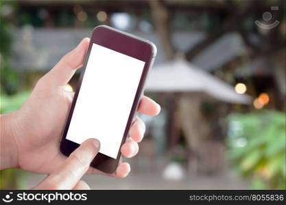 Woman hand holding smart phone with cafe blurred abstract background