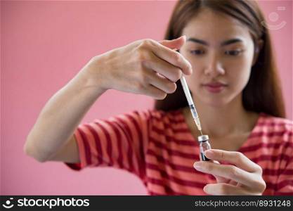 woman hand holding syringe for doctor order