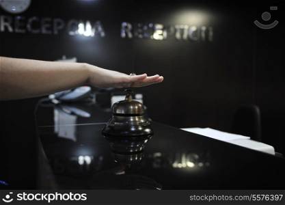 woman hand pressing reception bell in 4 stars hotel