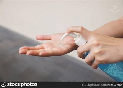 Woman Hand Pump Alcohol Gel in order to Kill Germs