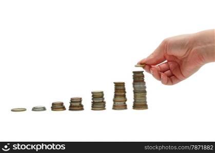 woman hand putting money coins to stack over white